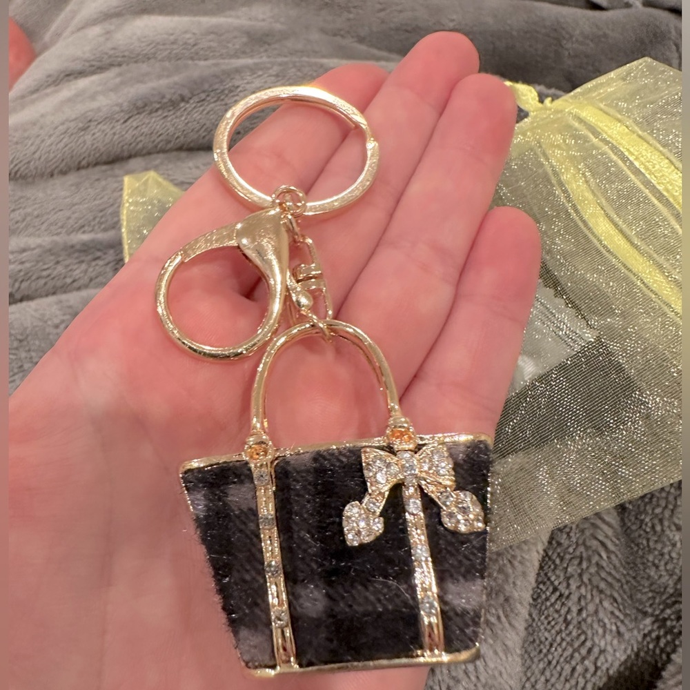 - Black and grey purse charm unbranded and new.